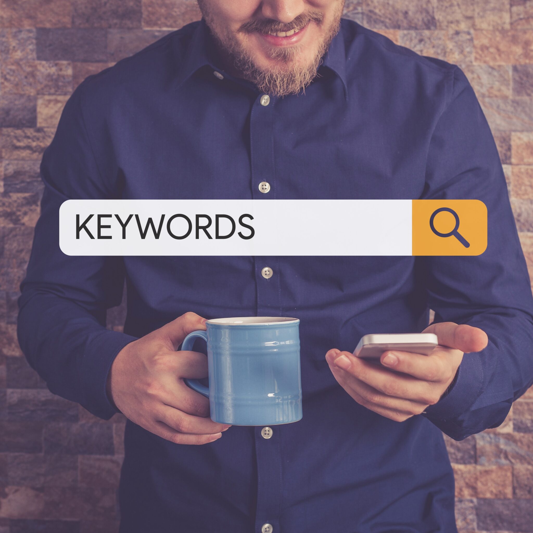 Man holding his phone and a mug searches for keywords